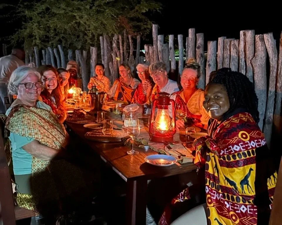 Yoga Safari Retreat Guests Enjoying a traditional boma dinner beneath the Botswana sky