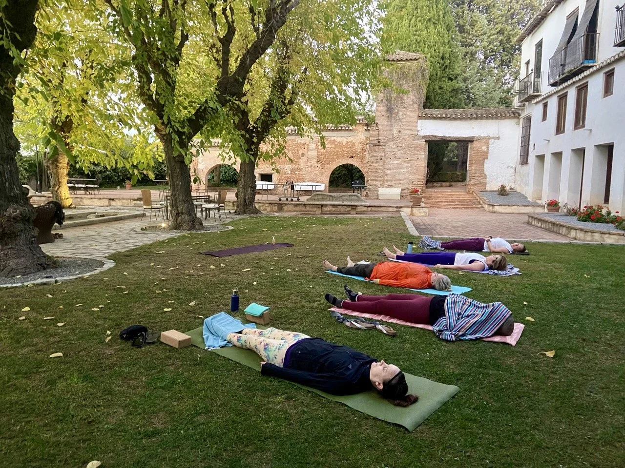 Granada Yoga Retreat Participants in Savasana in the garden