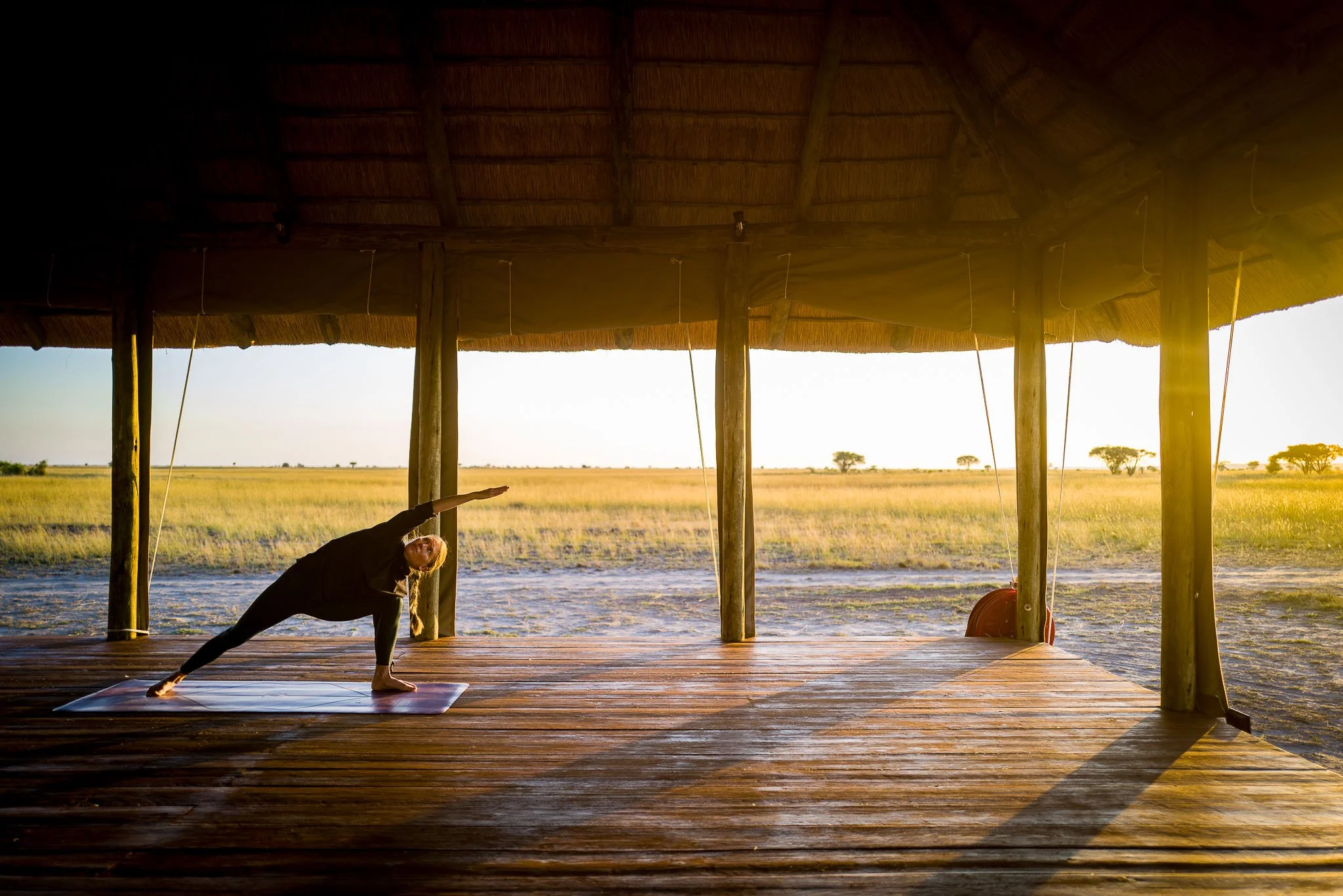Open-air yoga shala overlooking the Botswana landscape at Munga Plains