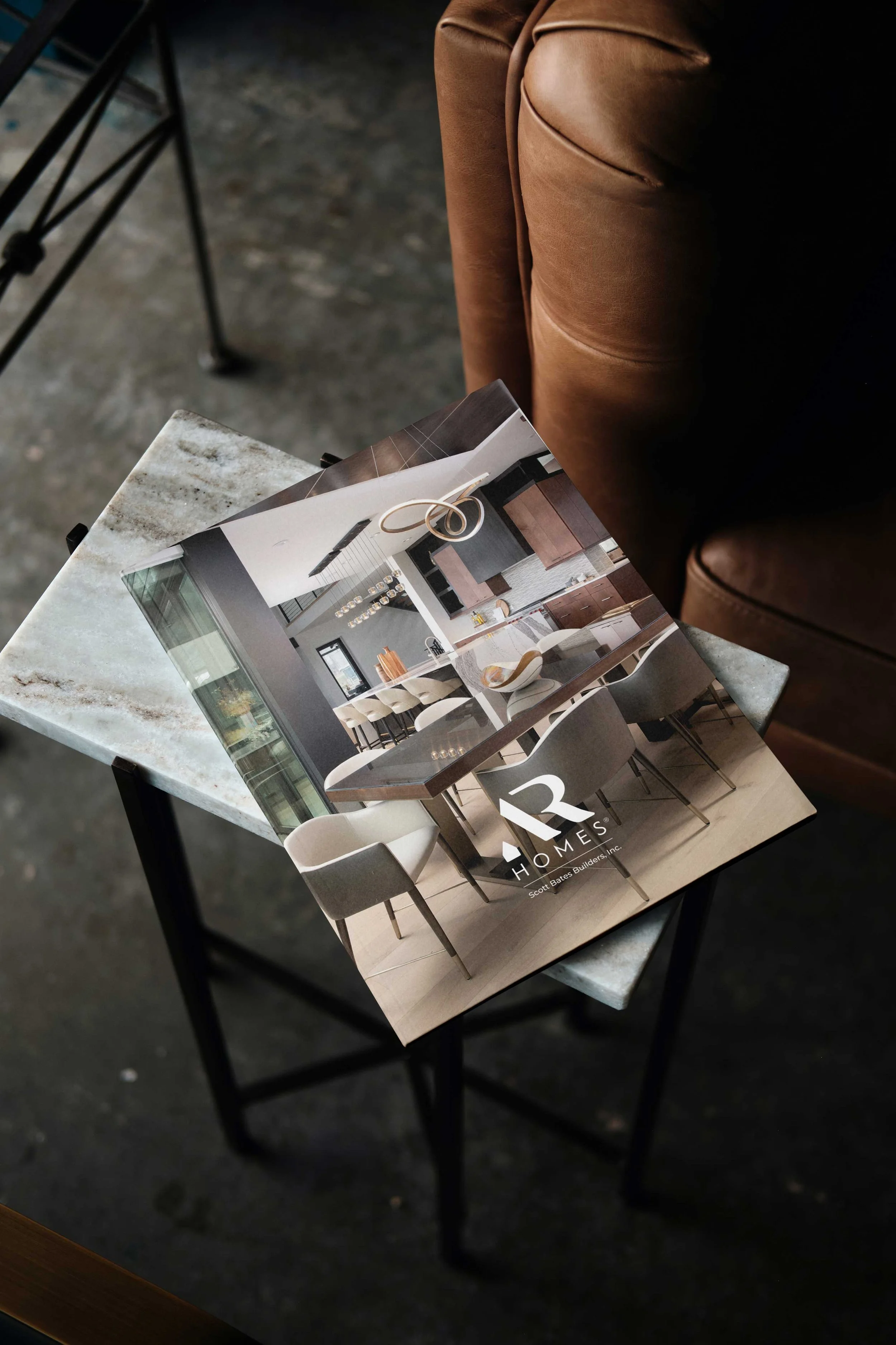 Photograph of a print brochure on a side table