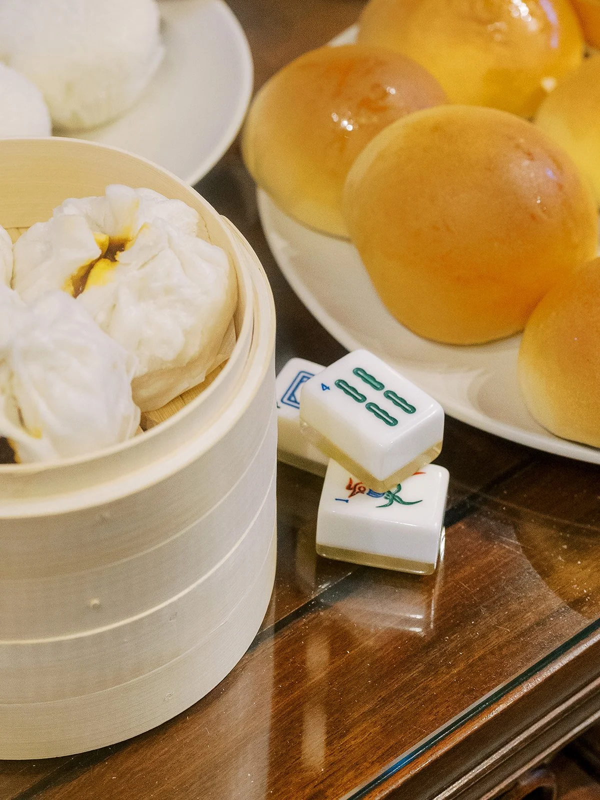 Steamed buns and mahjong tiles styled together for a playful, culture forward bachelorette party.
