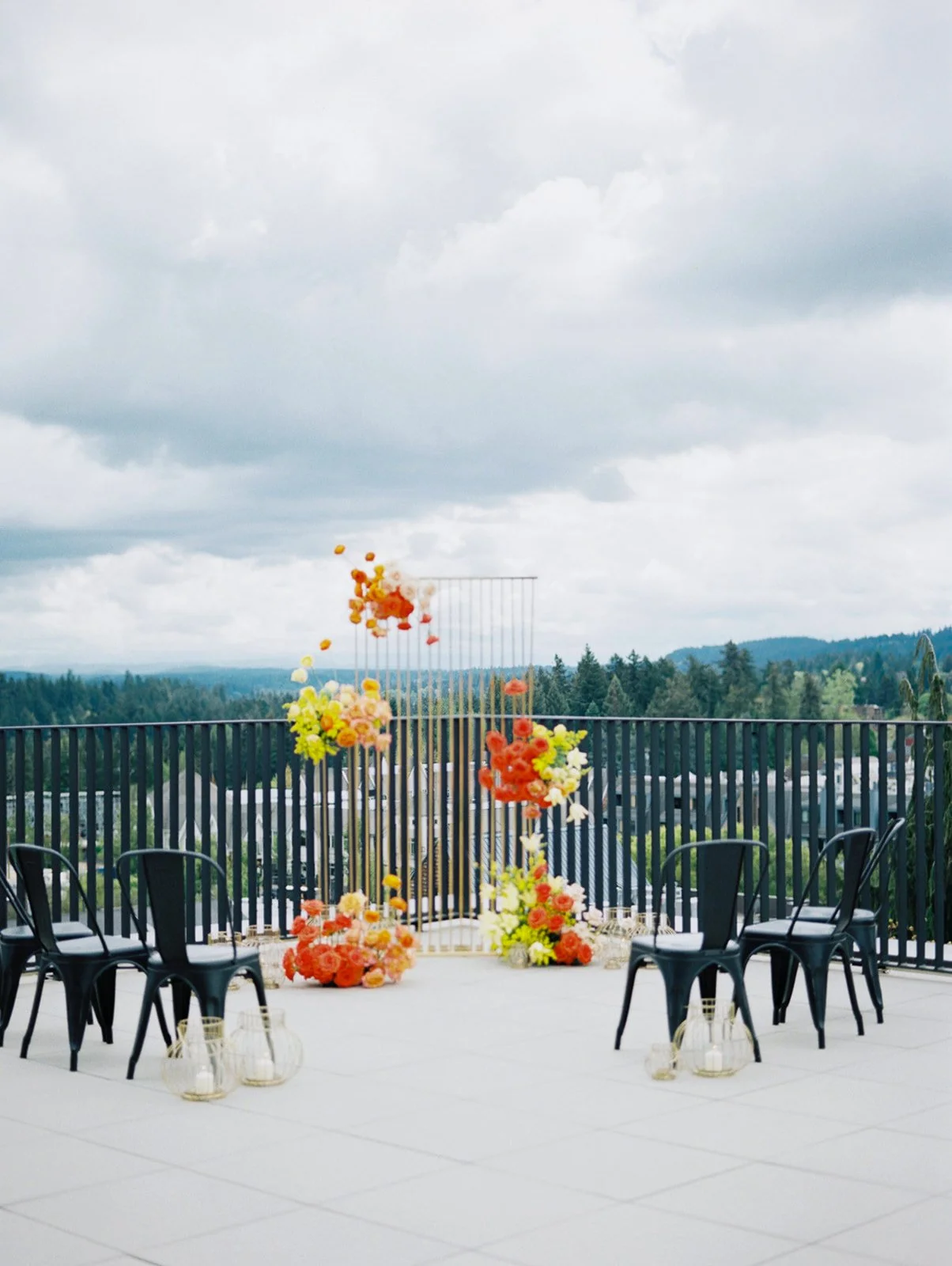Ironlight rooftop ceremony space with colorful florals and city views in Portland Oregon