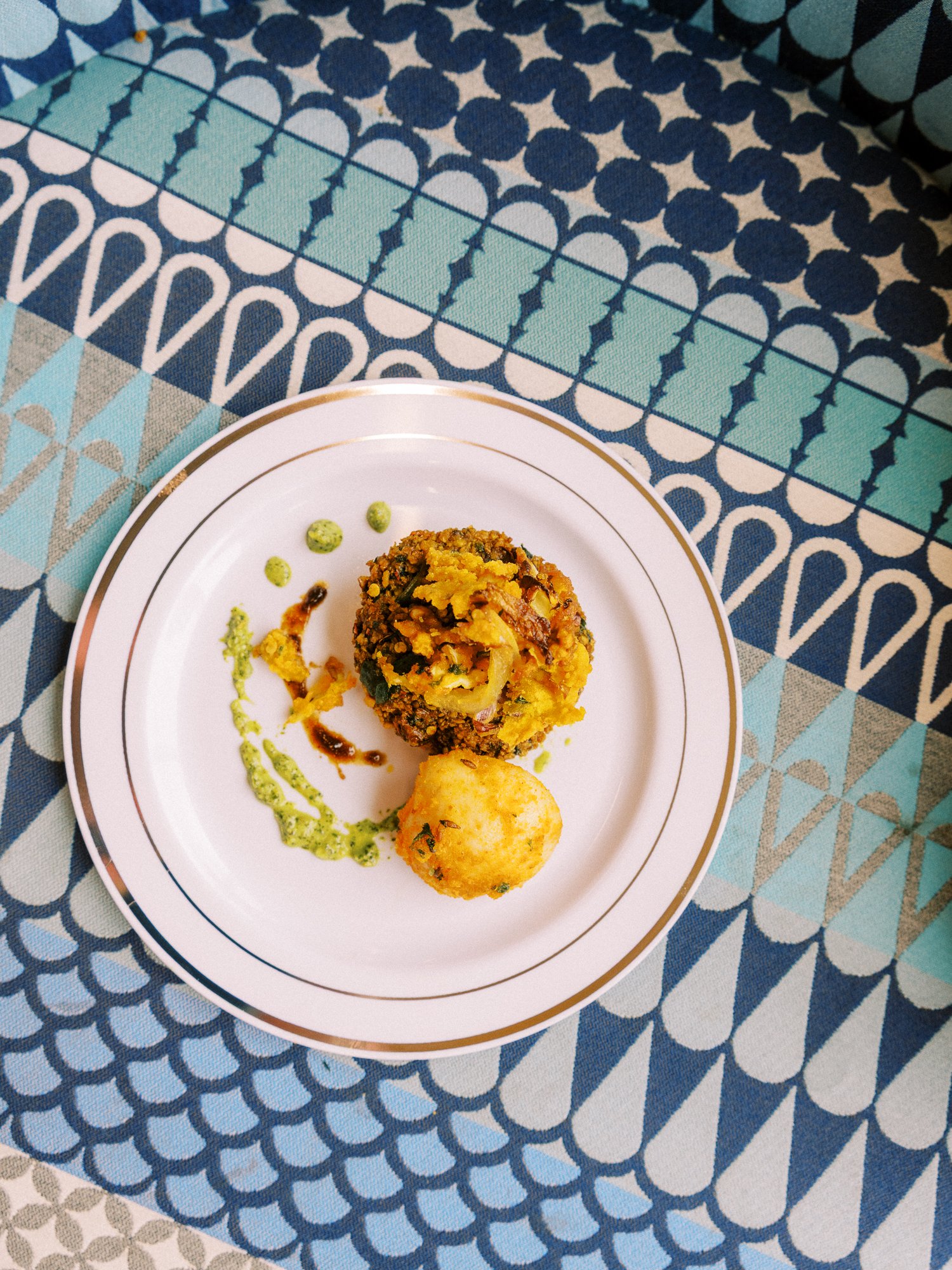 Plate of Indian food and sauces served during Alacia and Rohit’s Mehndi celebration.
