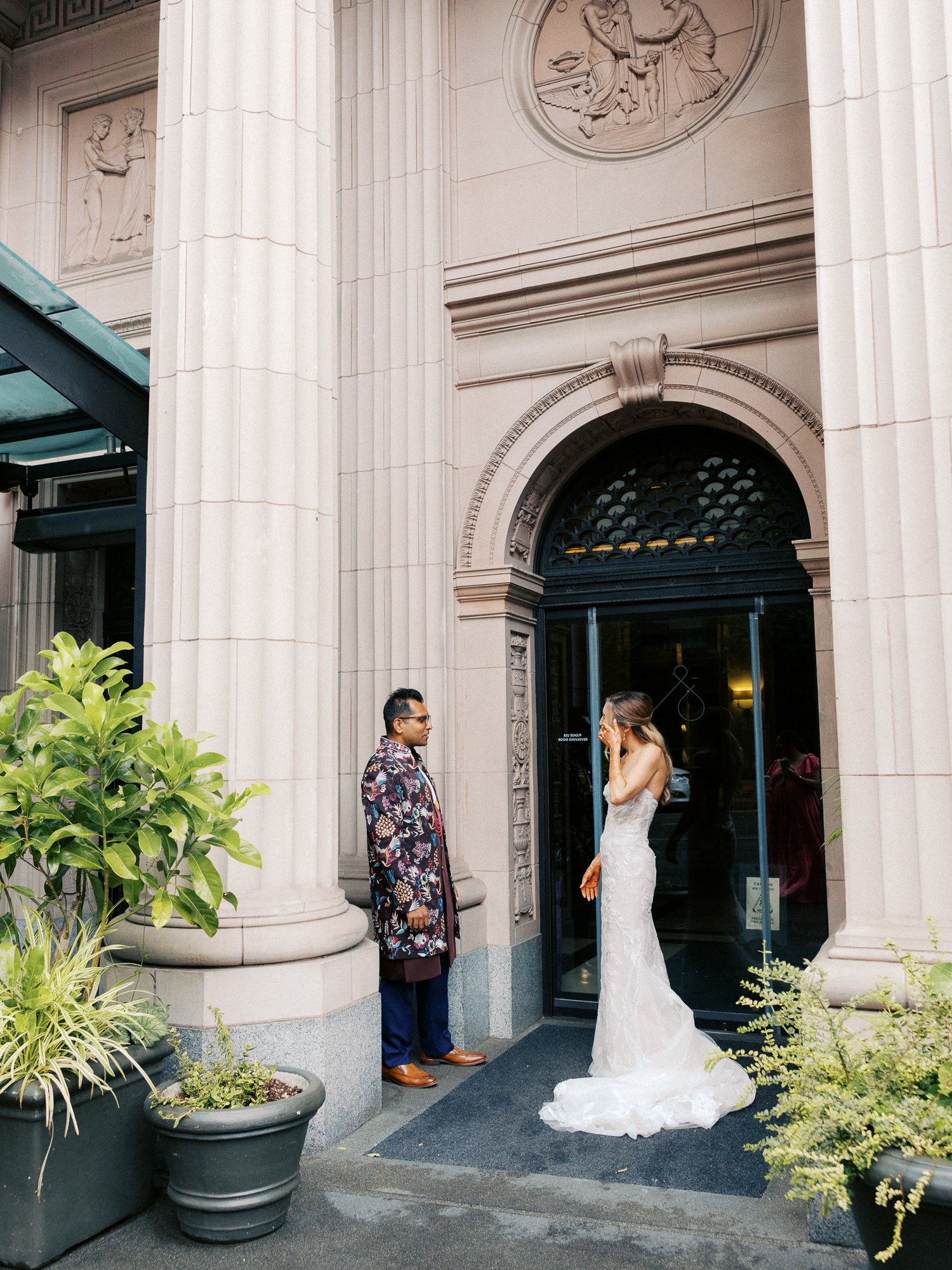 Bride and groom see each other for the first time outside the Sentinel Hotel entrance.