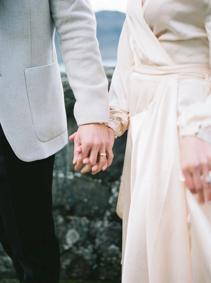 Close-up of couple holding hands during engagement session at Columbia Gorge Hotel