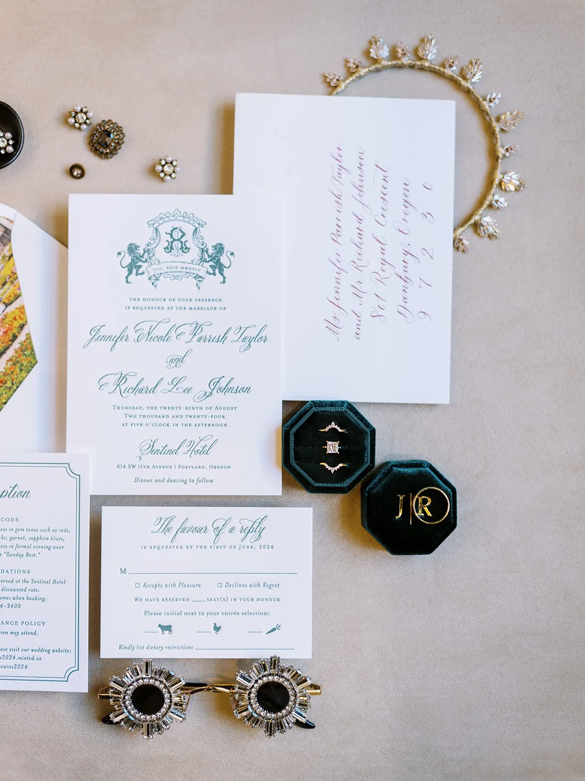 Wedding invitation and RSVP cards styled with heirloom jewelry, ring boxes, and gold headpiece at Sentinel Hotel.