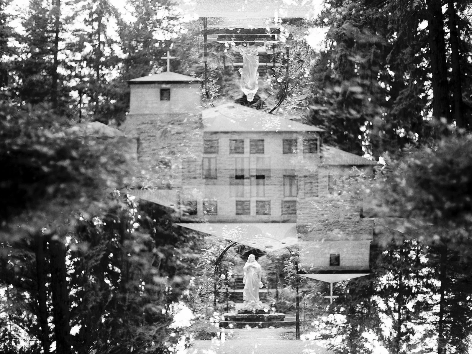 Black and white double-exposure of The Grotto's stone building and a garden Mary statue, layered with the surrounding forest canopy