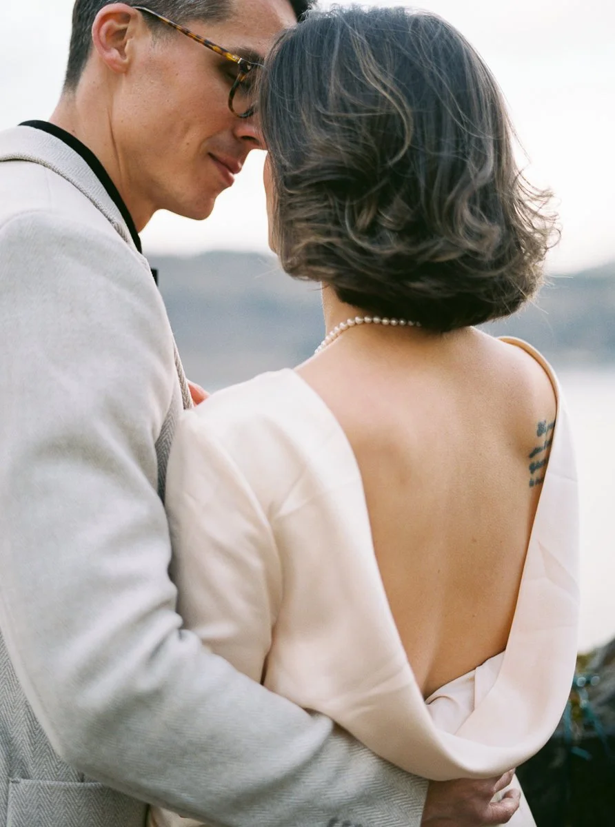 Intimate close-up of couple leaning together at Columbia Gorge Hotel overlook