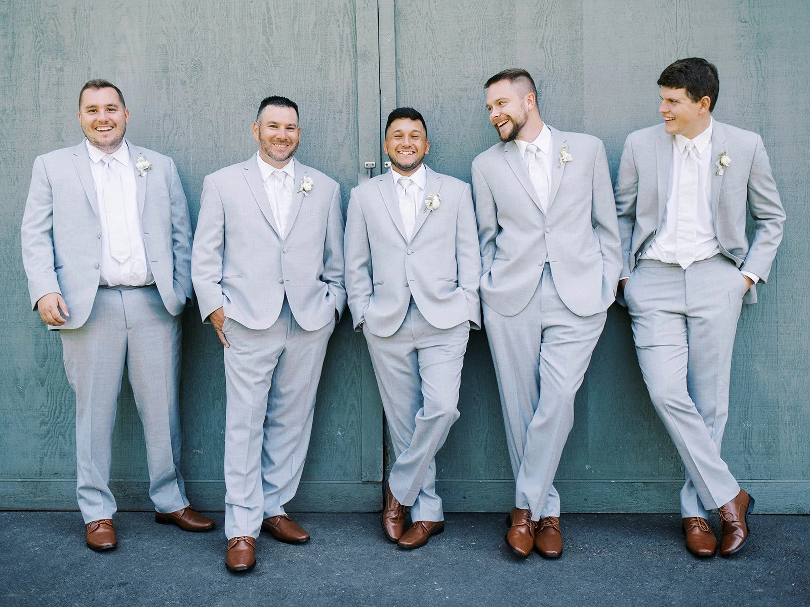 Wedding party portraits with groom and groomsmen in coordinated gray suits at Abigail’s Garden.