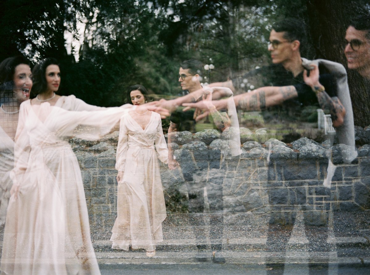 Artistic double exposure portrait of an anniversary couple at the Columbia Gorge Hotel, blending movement, stone textures, and moody Oregon atmosphere on film.