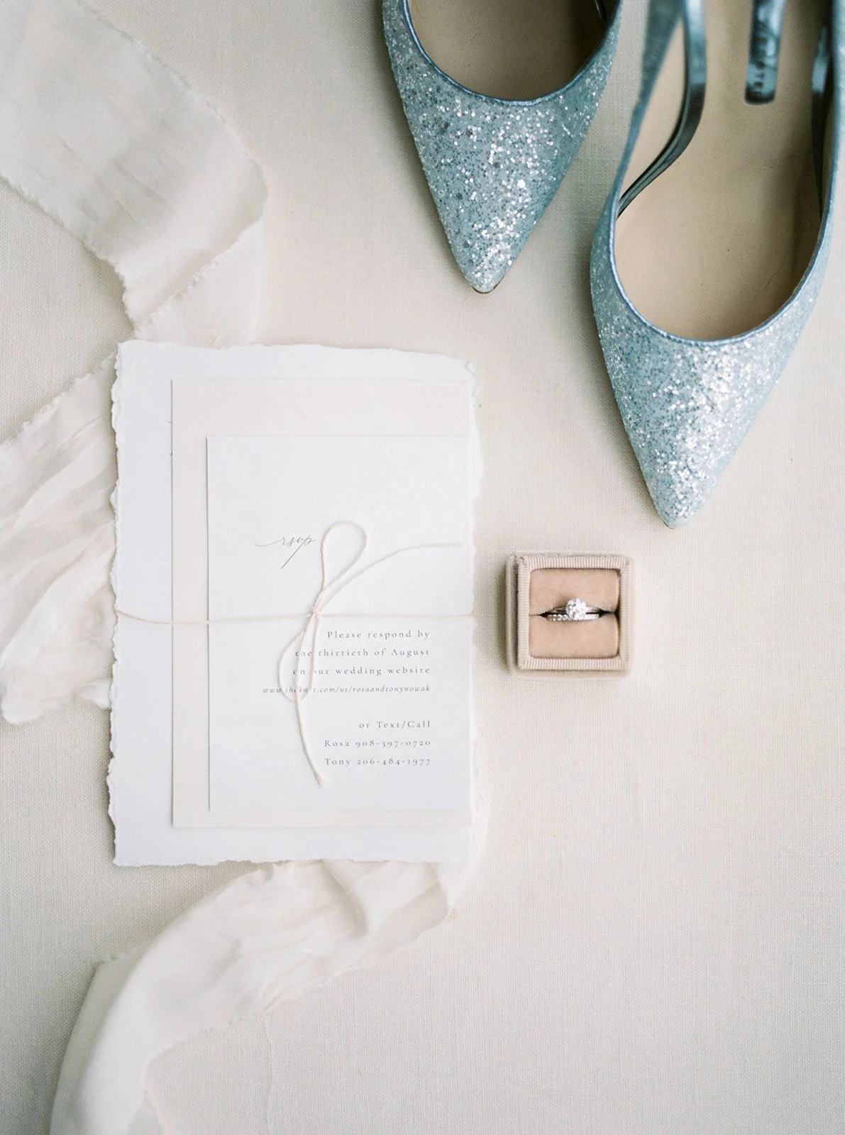 Wedding invitation suite with sparkling blue heels and an engagement ring for a Portland, Oregon wedding.