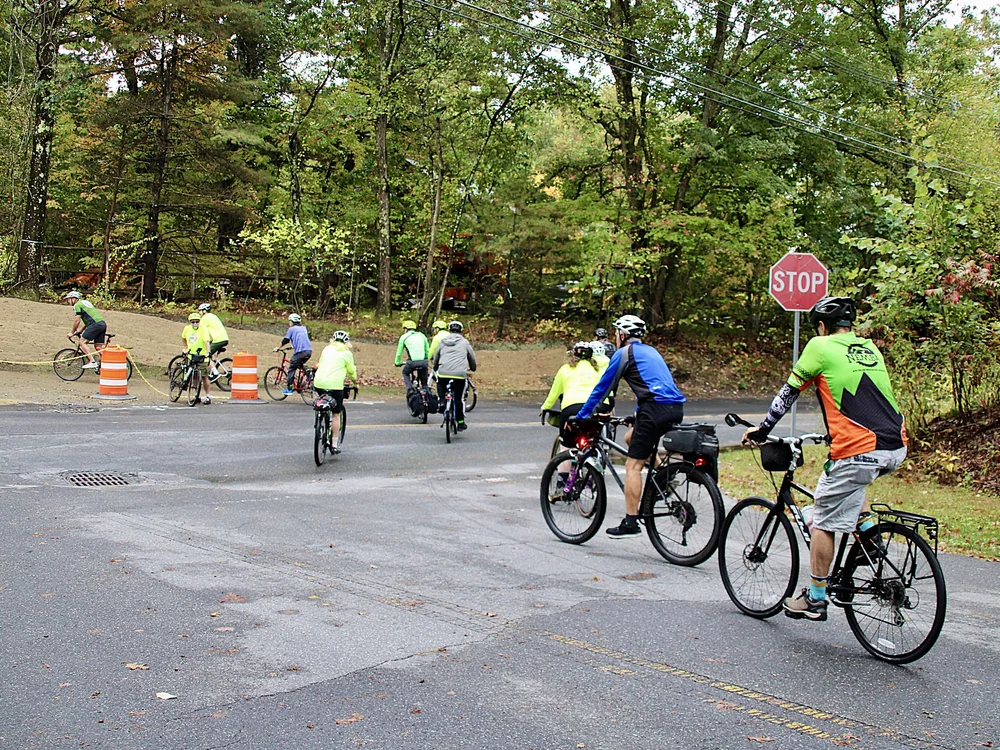  The link to the Mass Central Rail Trail from Hudson's Assabet River Rail Trail isn't fully paved, but the bike riders who were traversing the entire trail over the weekend were undeterred. Photo credit: Mass Parks for All. 