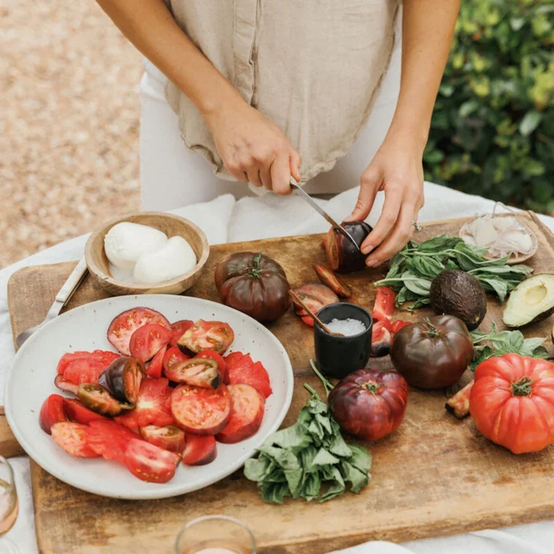 Slicing fresh ingredients on a wooden board