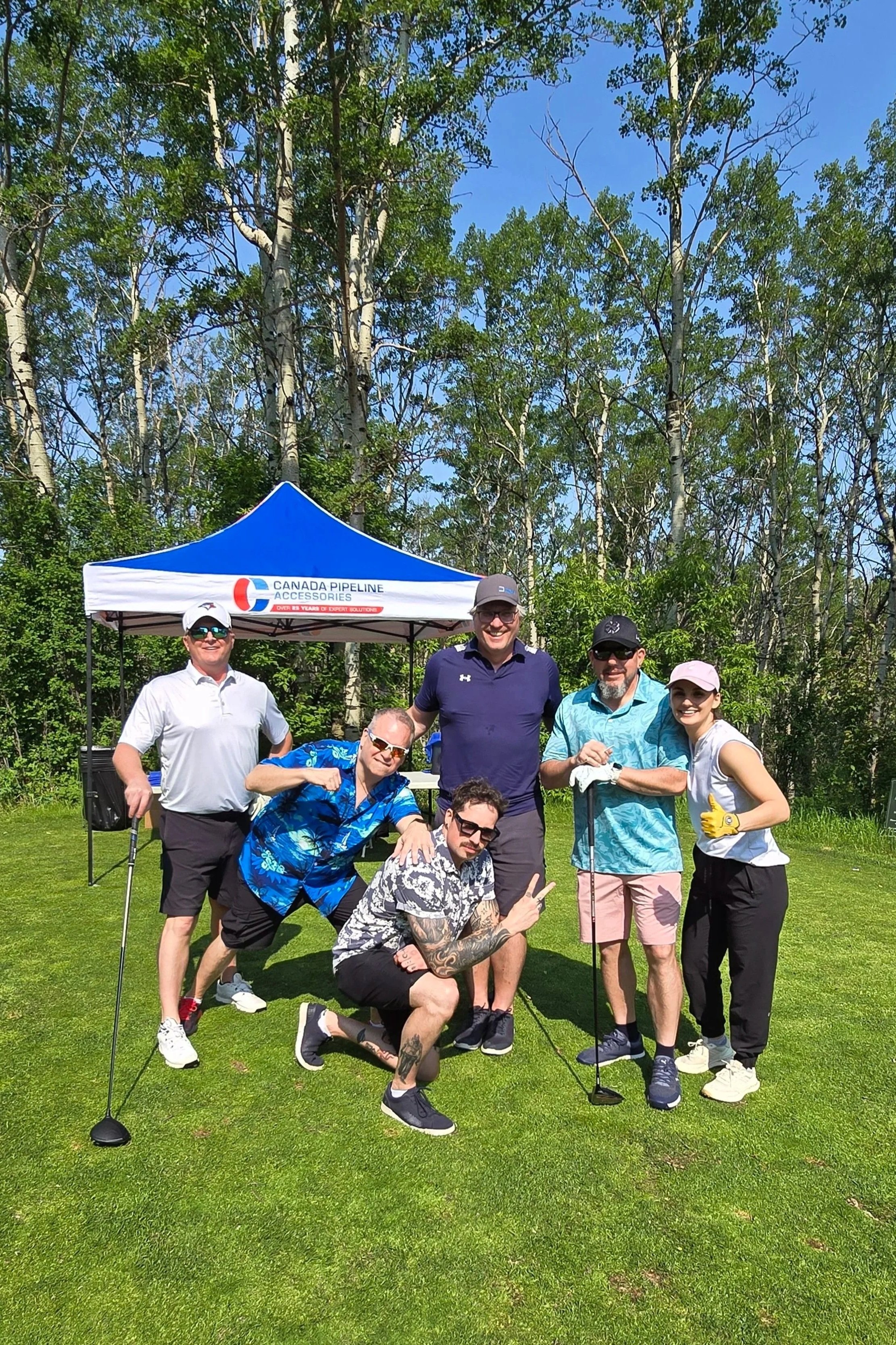 Group of participants enjoying a non-profit charity golf tournament coordinated by Calgary event planner Neesa and Co.