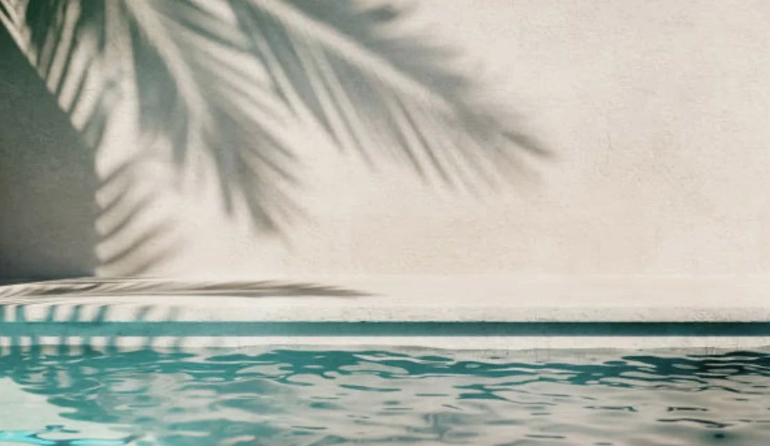 A boutique hotel pool at a luxury wellness retreat for women
