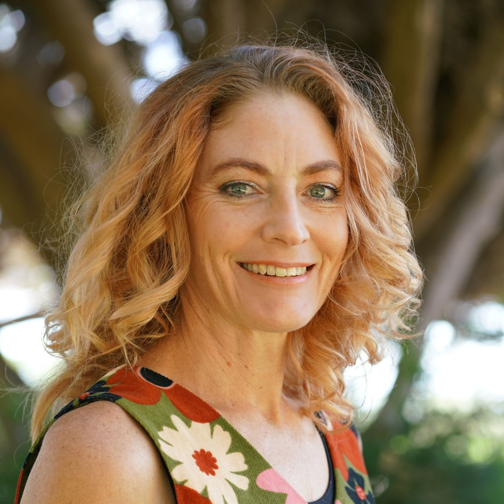 Rebecca Rickey from Acupuncture Sanctuary smiling outdoors in nature in Dunsborough