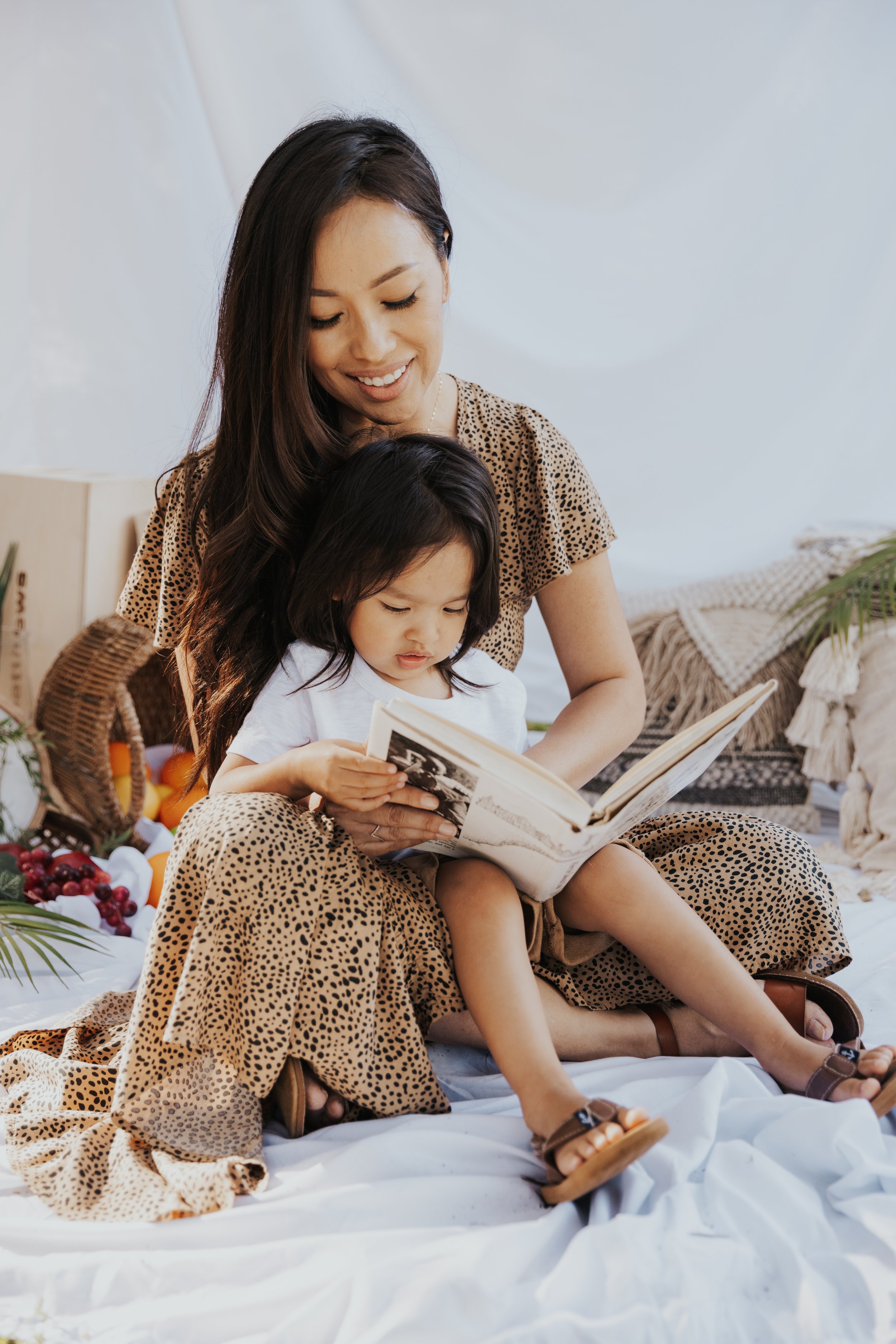 Motherhood Portrait of Sophea reading a book to Kylion
