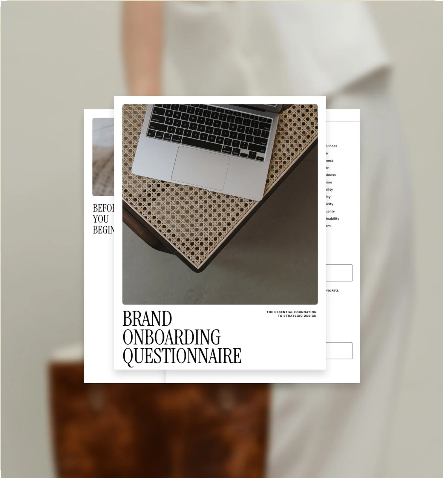 Cover page of a document titled "Brand Onboarding Questionnaire" with a laptop on a woven surface.