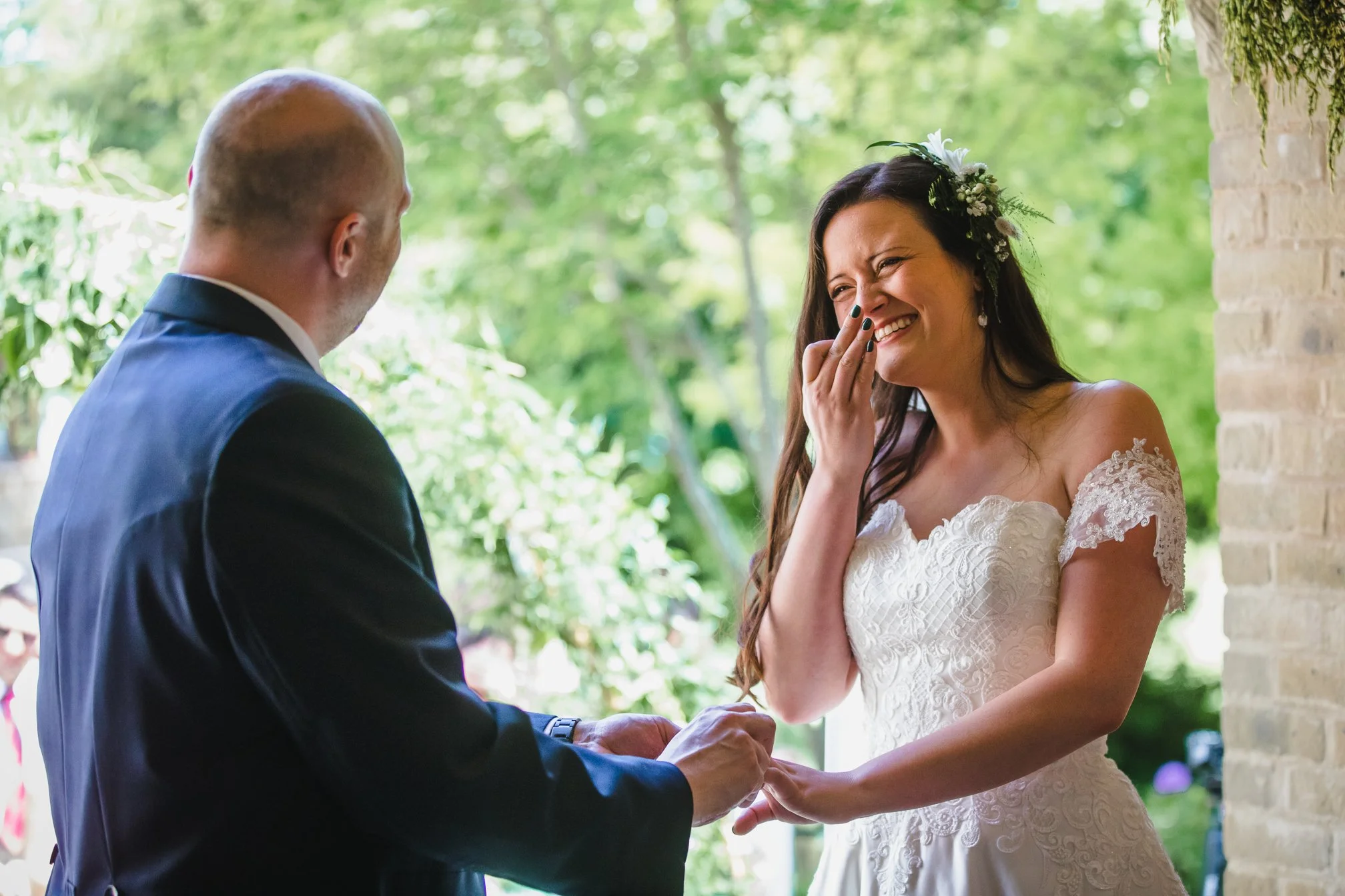 Photography at Ravenswood wedding venue copthorne by female west sussex wedding photographers a candid story telling reportage style of photography for relaxed couples