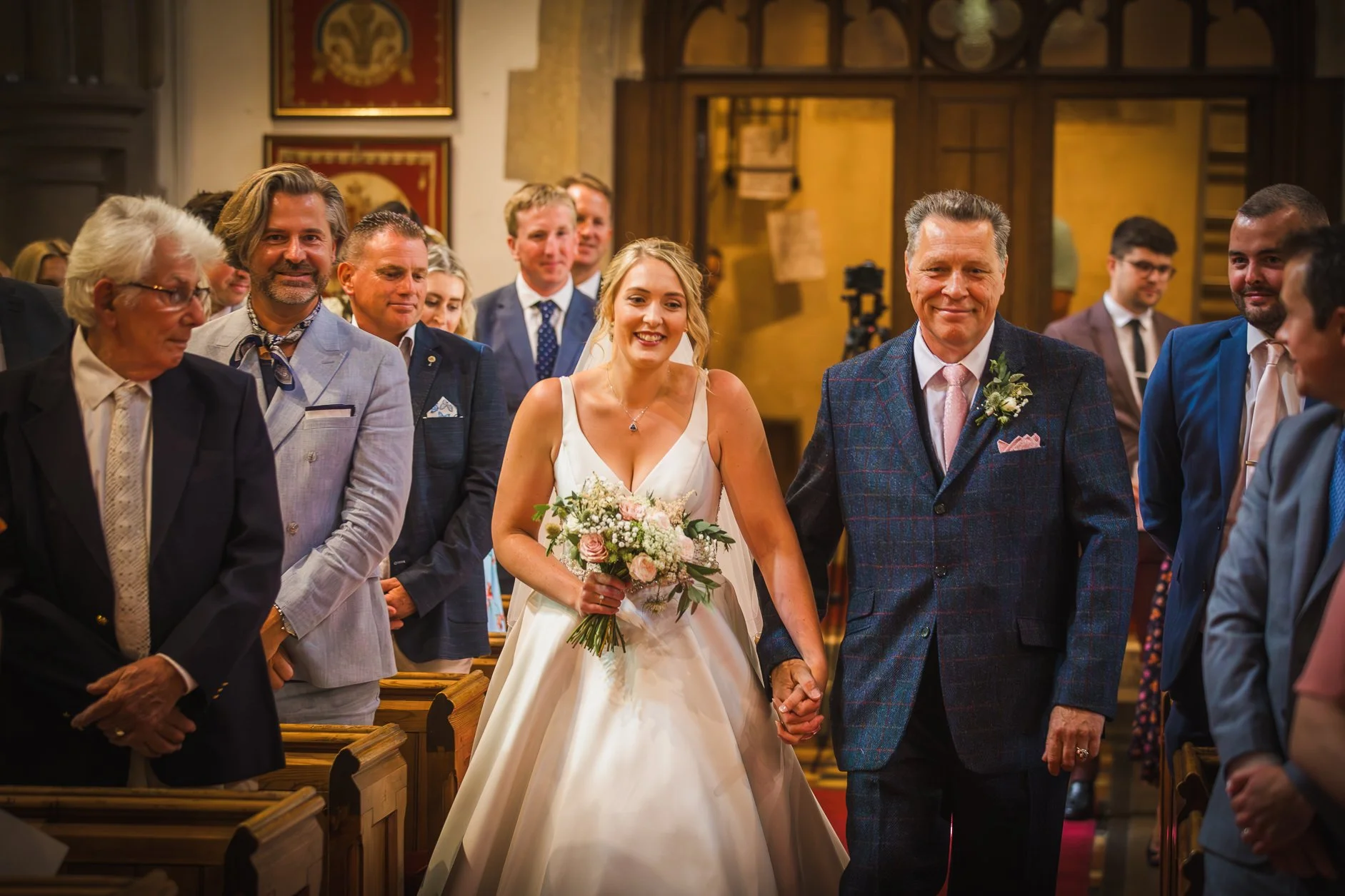 Best Wedding photographers in West Sussex Barn fitzleroi - bride walking down aisle at St marys Fittleworth with her dad looking proud