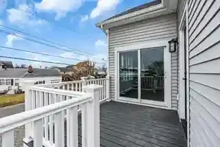 a deck outside of a new addition that was built