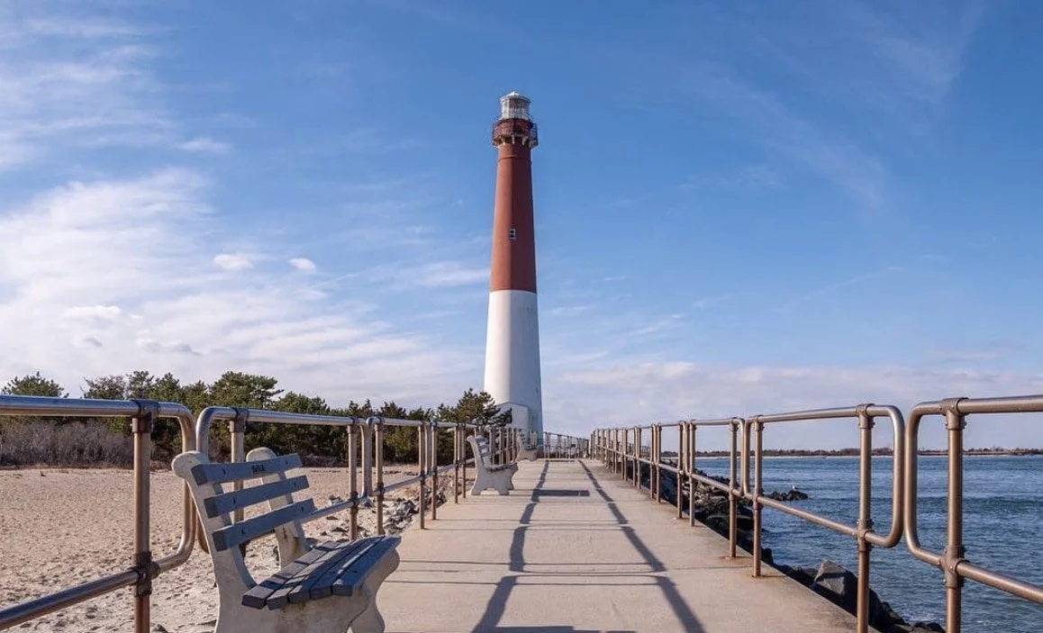 Barnegat Lighthouse on LBI - a red and white lighthouse overlooking the ocean
