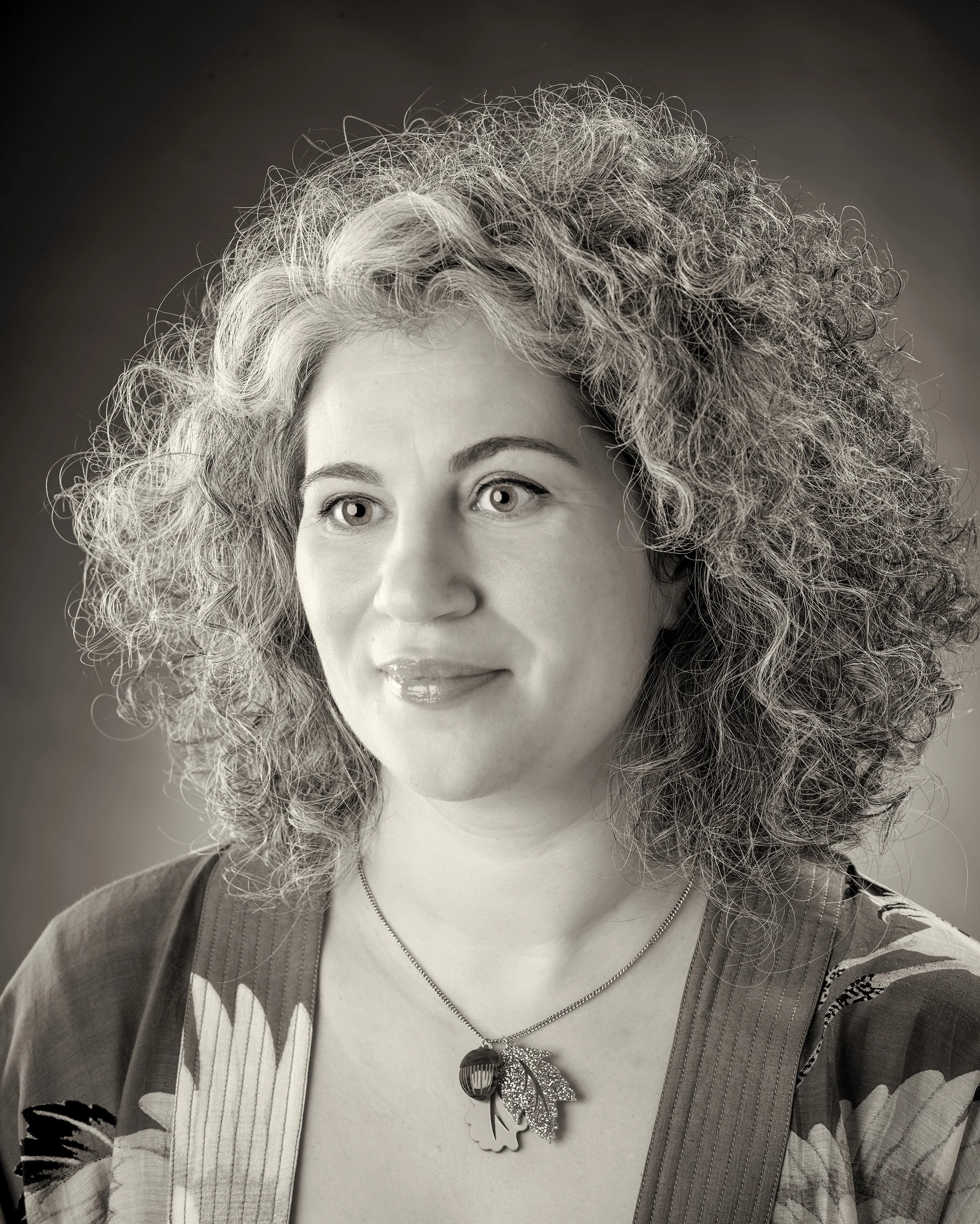 Black and white photograph of Amy Shulman, Business Development Manager of White Crow Studios