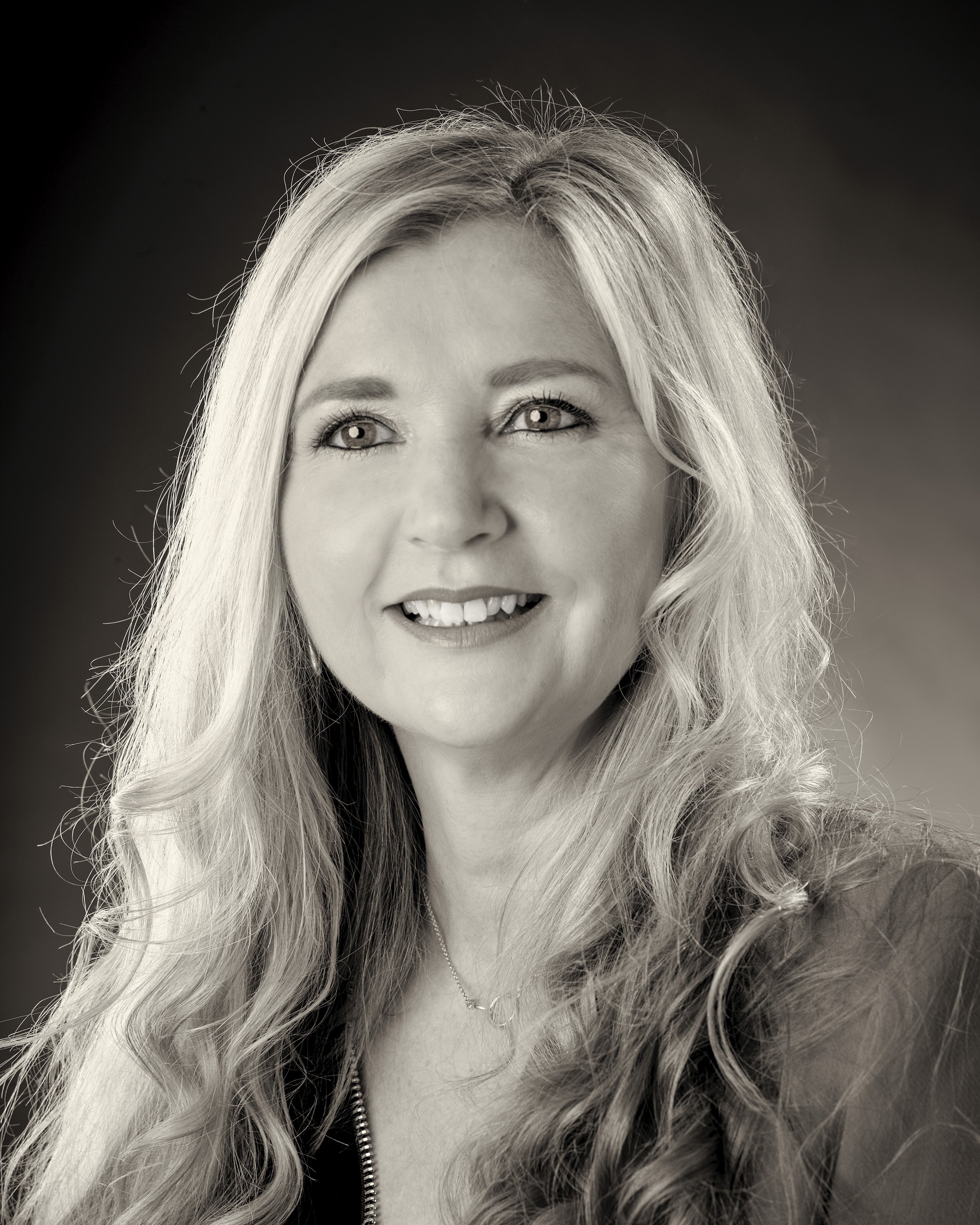 Black and white photograph of Lisa Pedley, Director of White Crow Studios
