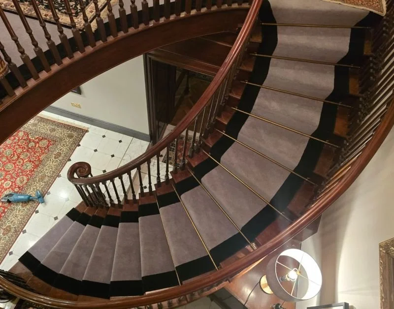 Spiral stair case stair runner with rods Sevenoaks.jpg