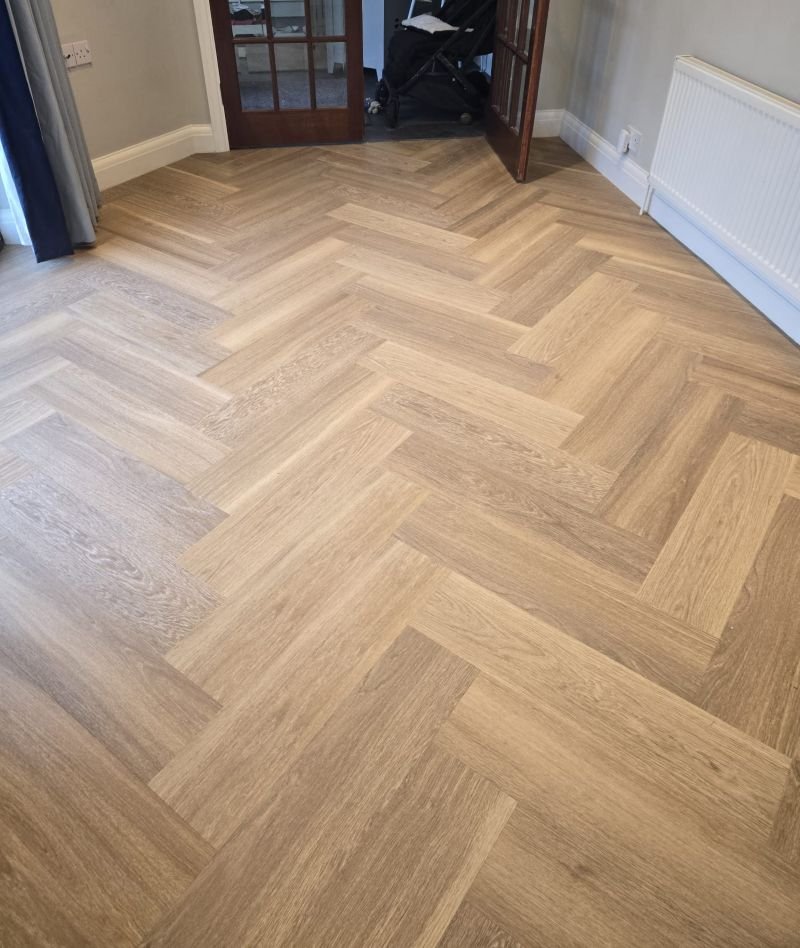Dining room flooring in LVT herringbone Park Langley.jpg