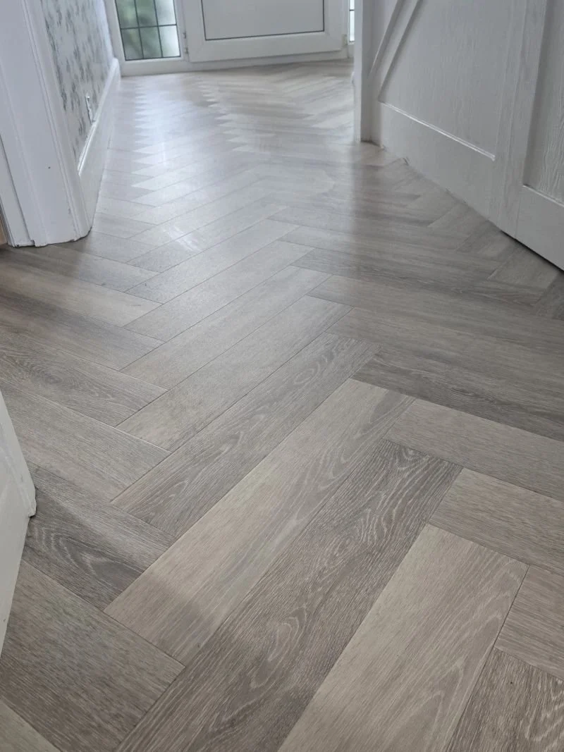 LVT Herringbone flooring LVT hallway.jpg