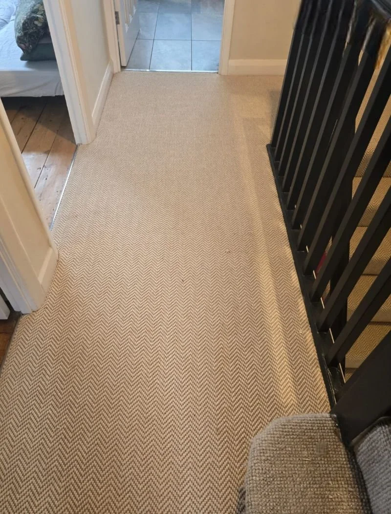 Herringbone carpet landing Catford.jpg