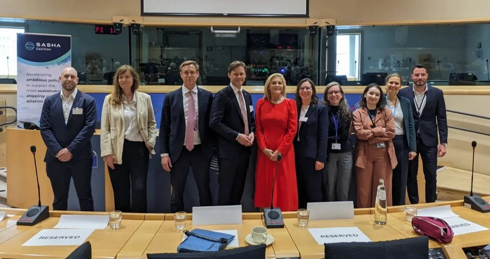 A row of people smiling who spoke on our panels at the EU ETS event.