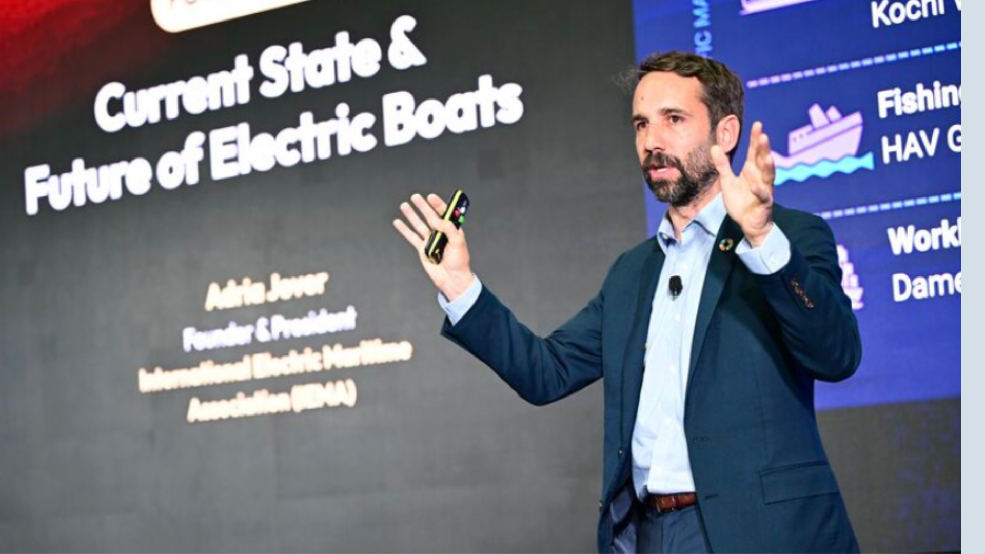 Adria Jover speaking on stage at an event