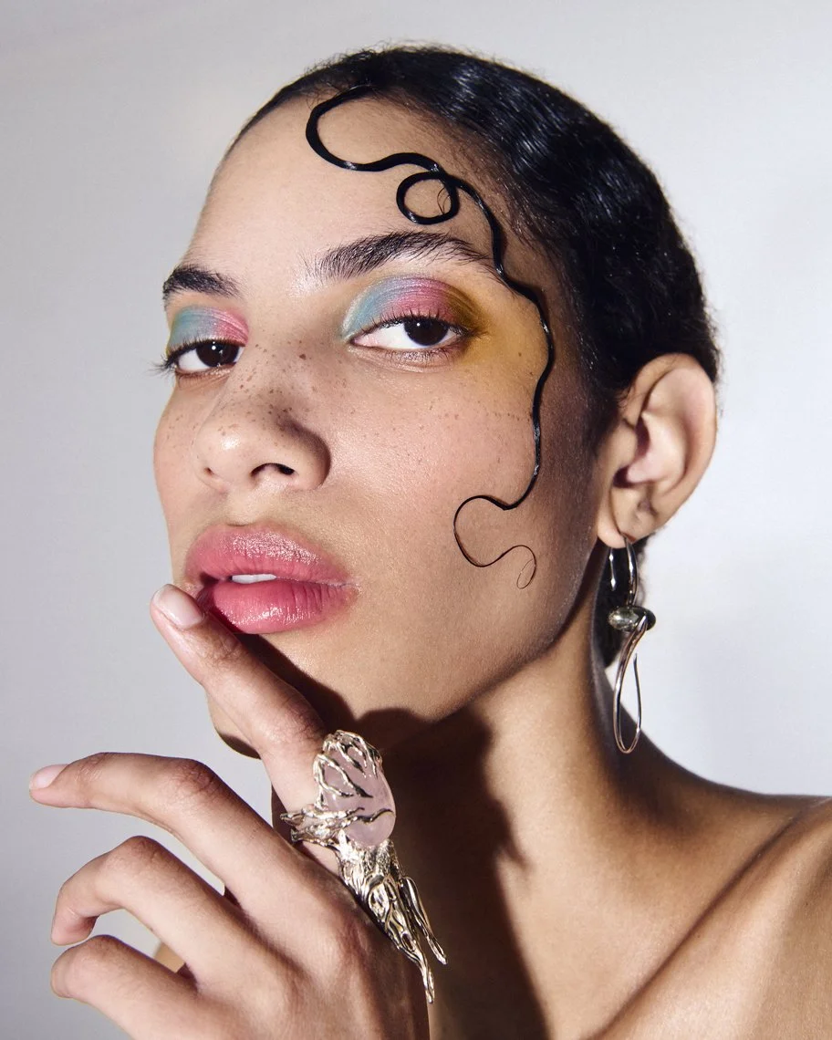Creative editorial makeup with multi-color eyeshadows