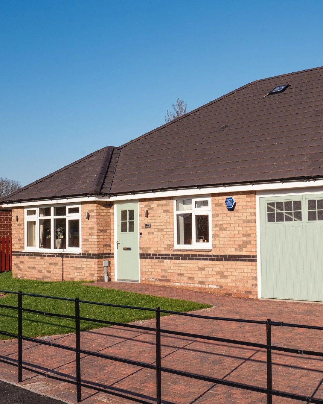 It&rsquo;s the details that make a home feel considered.

Soft sage tones across the front door, garage and window frames bring a sense of calm and character, a subtle choice that sits beautifully within its surroundings.