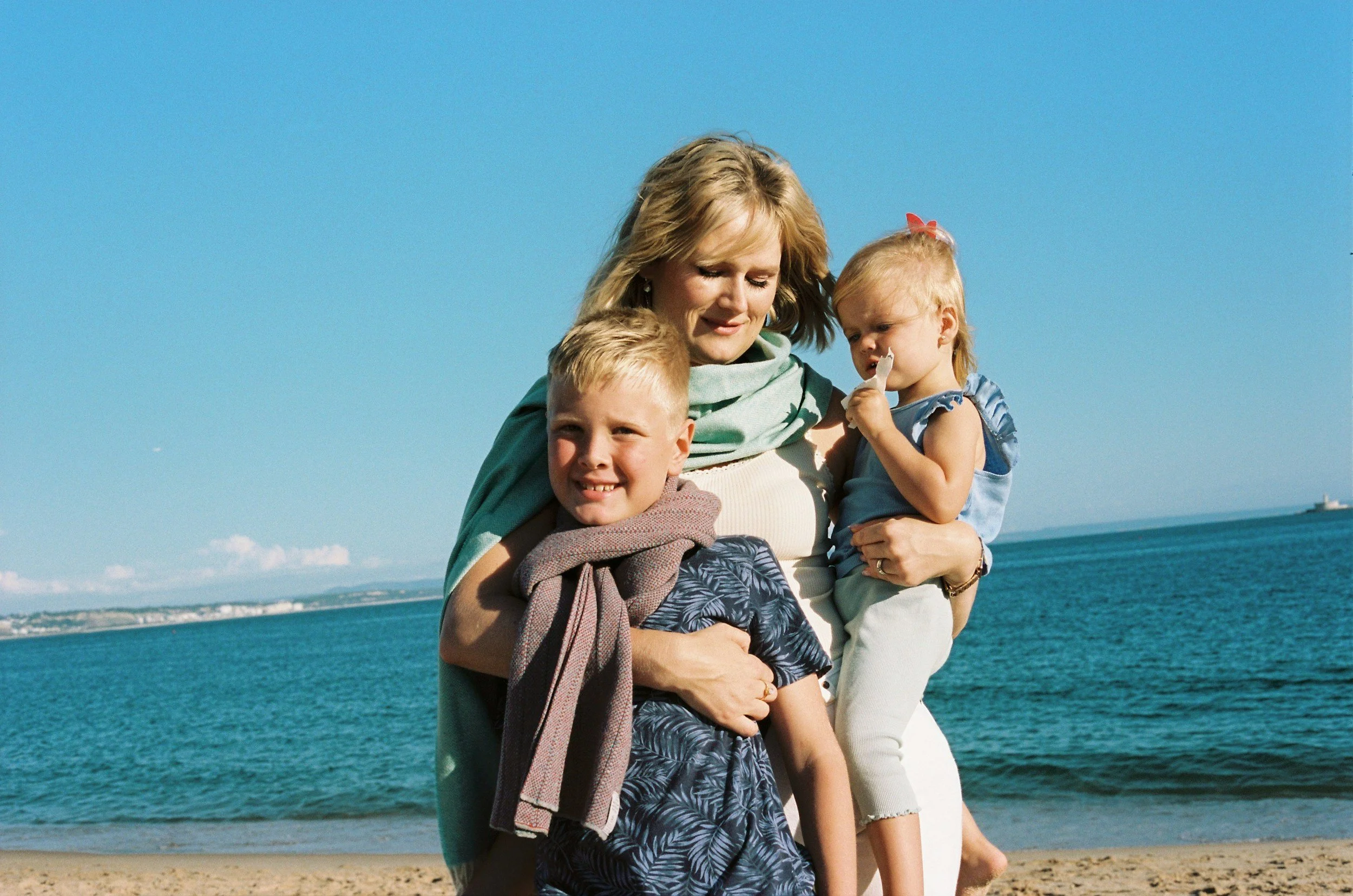 mum and two kids at the beach