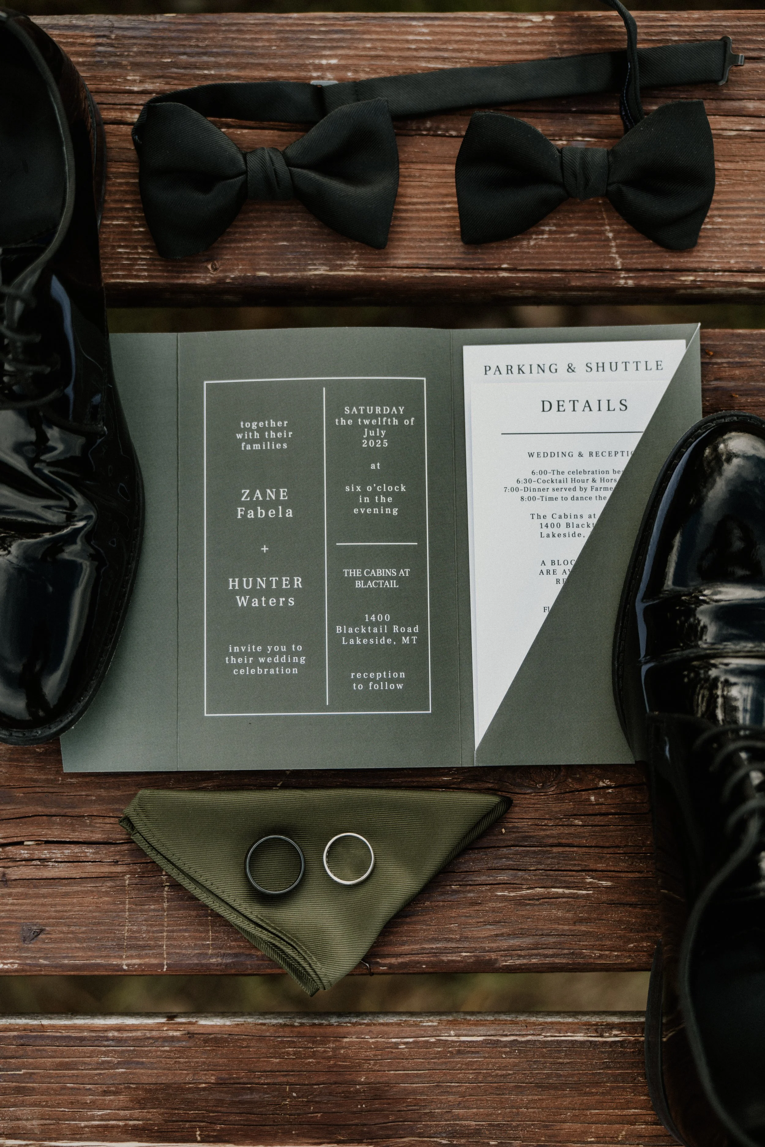Wedding invitation, black shoes, tuxedo bow ties, wedding bands, wedding details booklet, emerald green handkerchief.