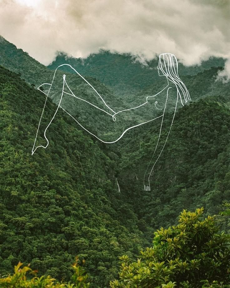 Mountains covered with trees with a line drawing of a woman sitting, created with white lines overlaying the landscape.