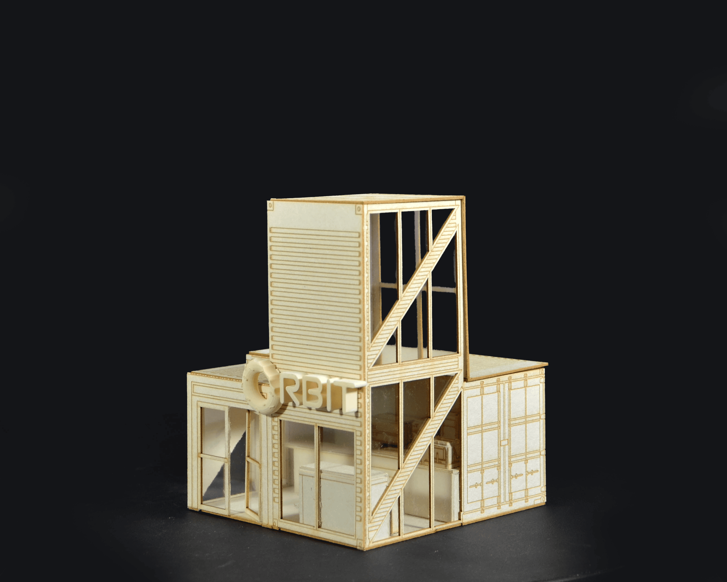 Wooden architectural model of a multi-story building with stairs, labeled "CRBIT" on the side, set against a black background.