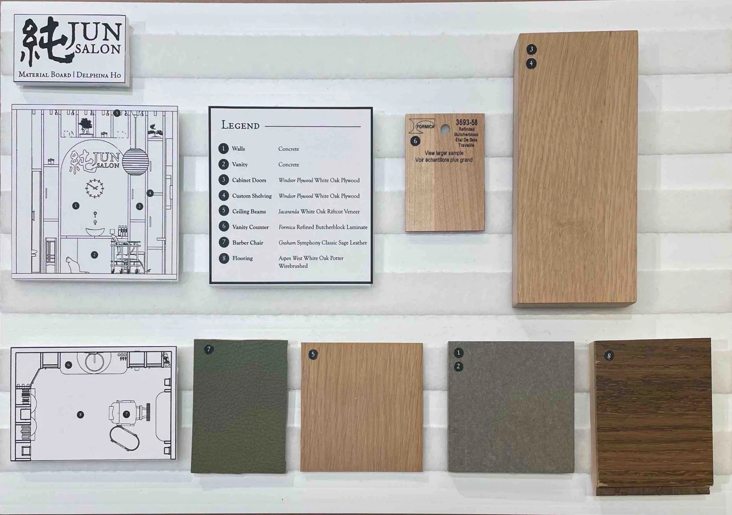 Display of architectural or interior design materials including wood samples, paint chips, and detailed floor plans for a salon project.