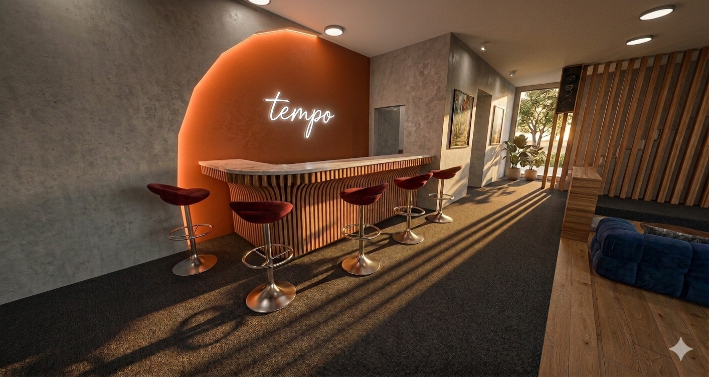Modern lounge area with a bar, illuminated 'tempo' sign, four barstools with maroon seats, decorative plants near the window, wooden and wall panel decor, and sunlight casting shadows on the carpet.