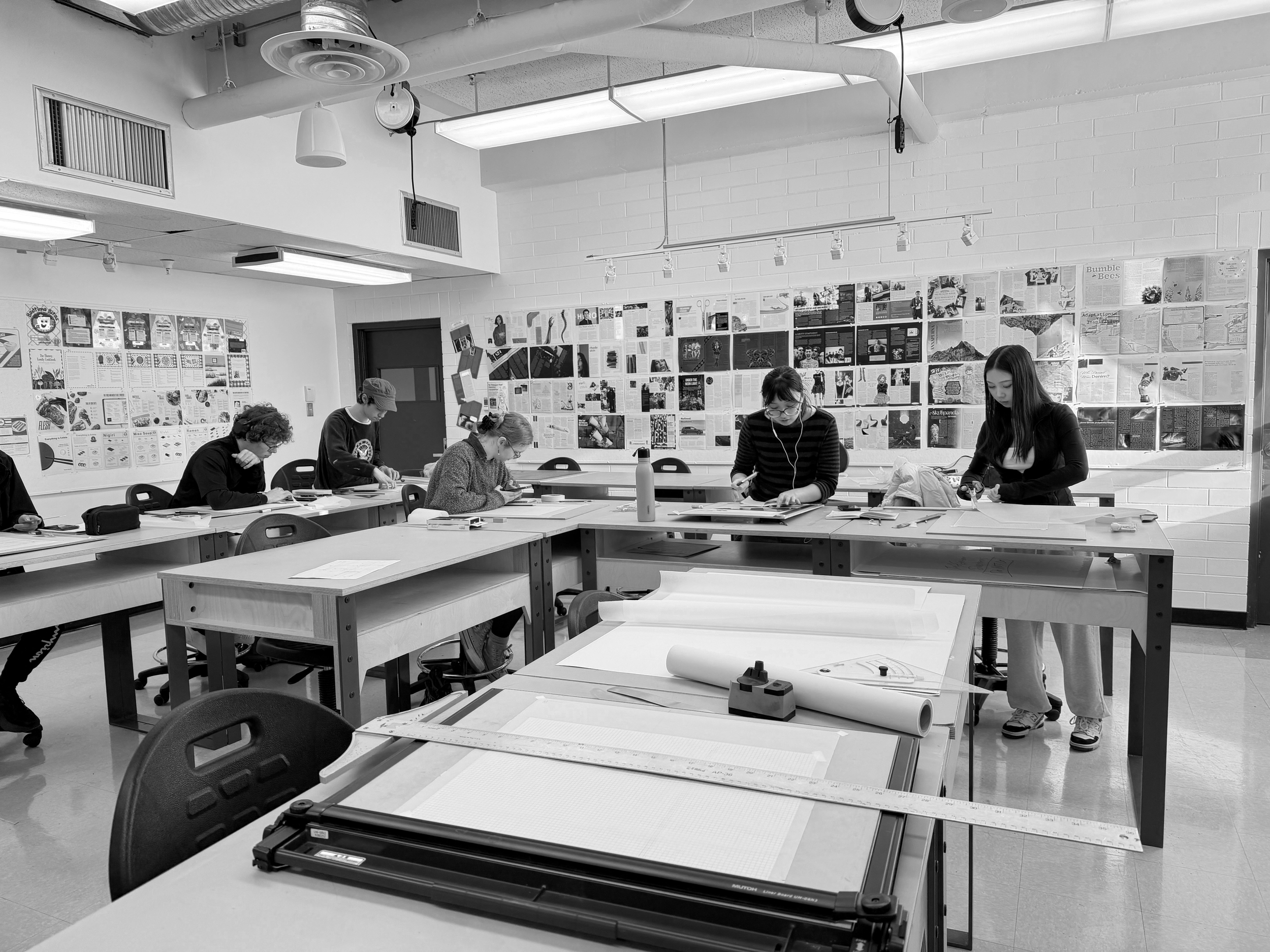 Design Formation students in the Langara studios using drafting tools to complete their projects