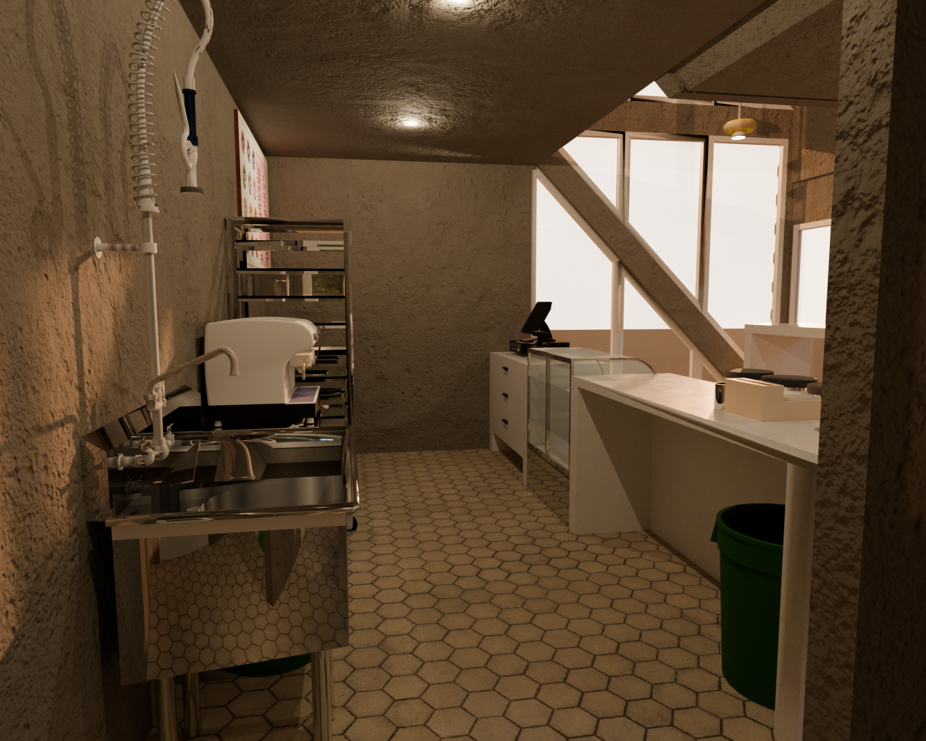 Break room or kitchen area with hexagonal tile floor, sink with faucet, shelving unit, and a counter with a point-of-sale system, under sloped ceiling and partial wall with windows.