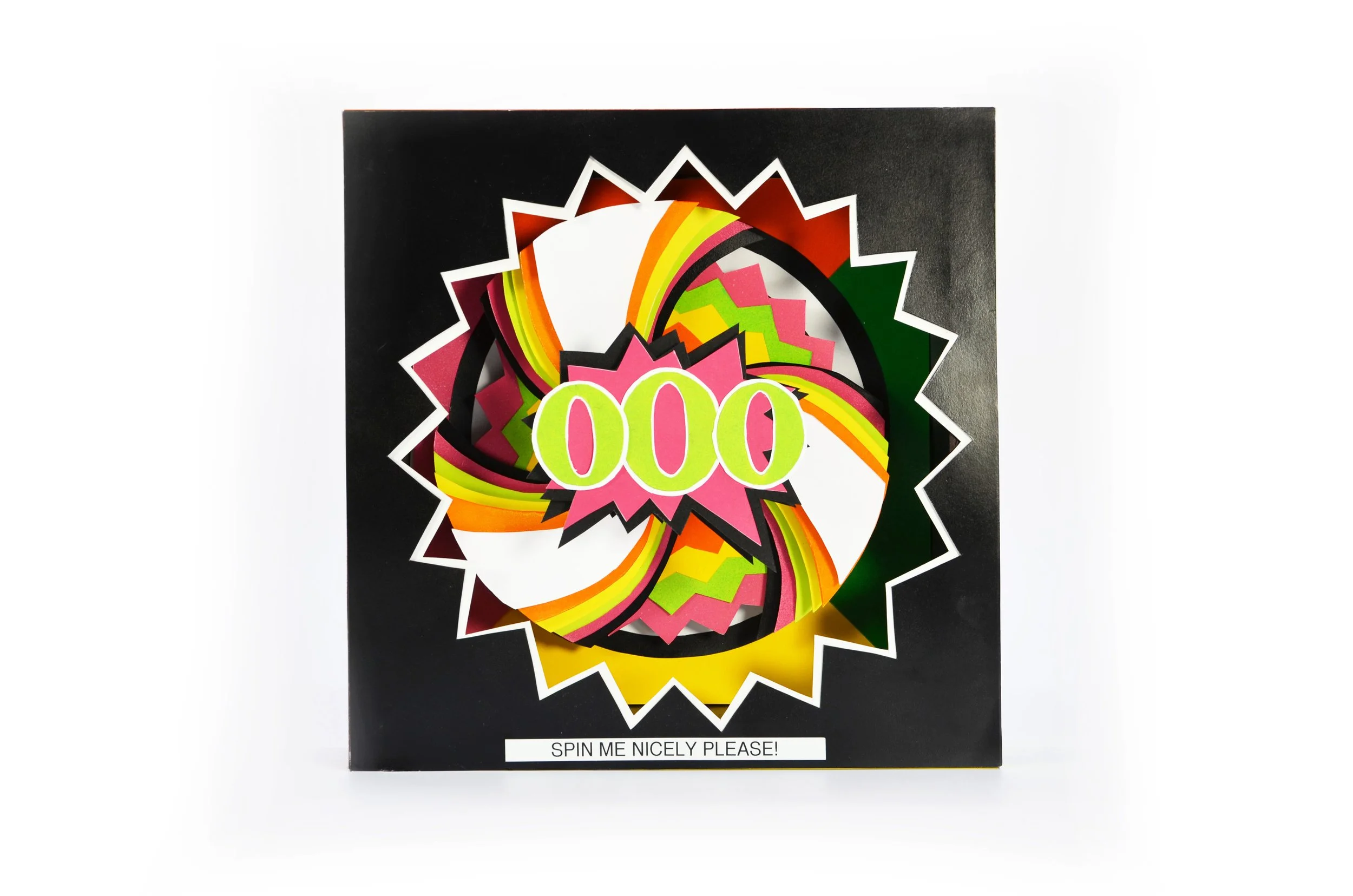 Colorful pop-art style paper poster with the number '100' in bright yellow-green, layered on vibrant rainbow-colored shapes with black outlines, on a black background, with a white text label at the bottom that says 'SPIN ME NICELY PLEASE!'