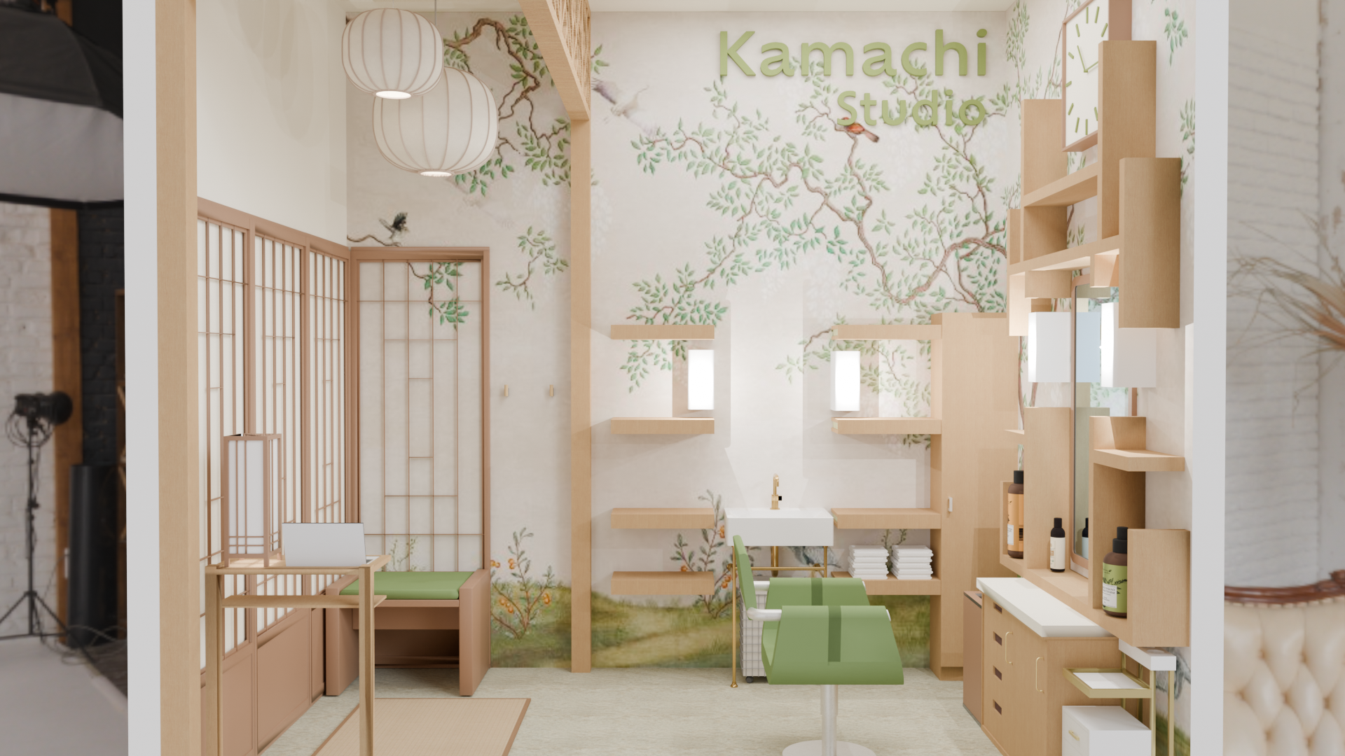 Interior of Kamachi Studio featuring a nature-themed mural wall, pastel green seating, wooden shelves, and Japanese-inspired decor elements.