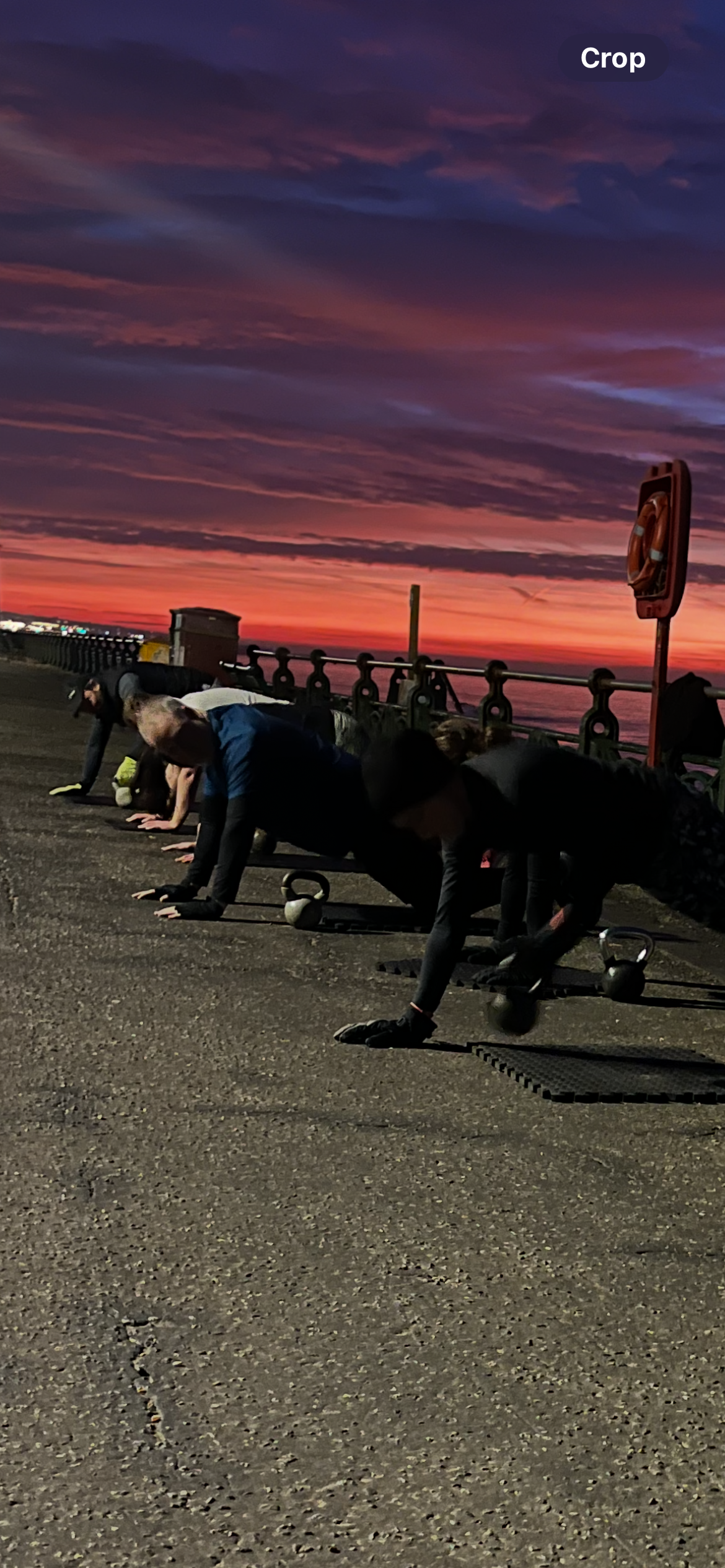Outdoor strength and Kettlebell class at sunrise on Brighton seafront