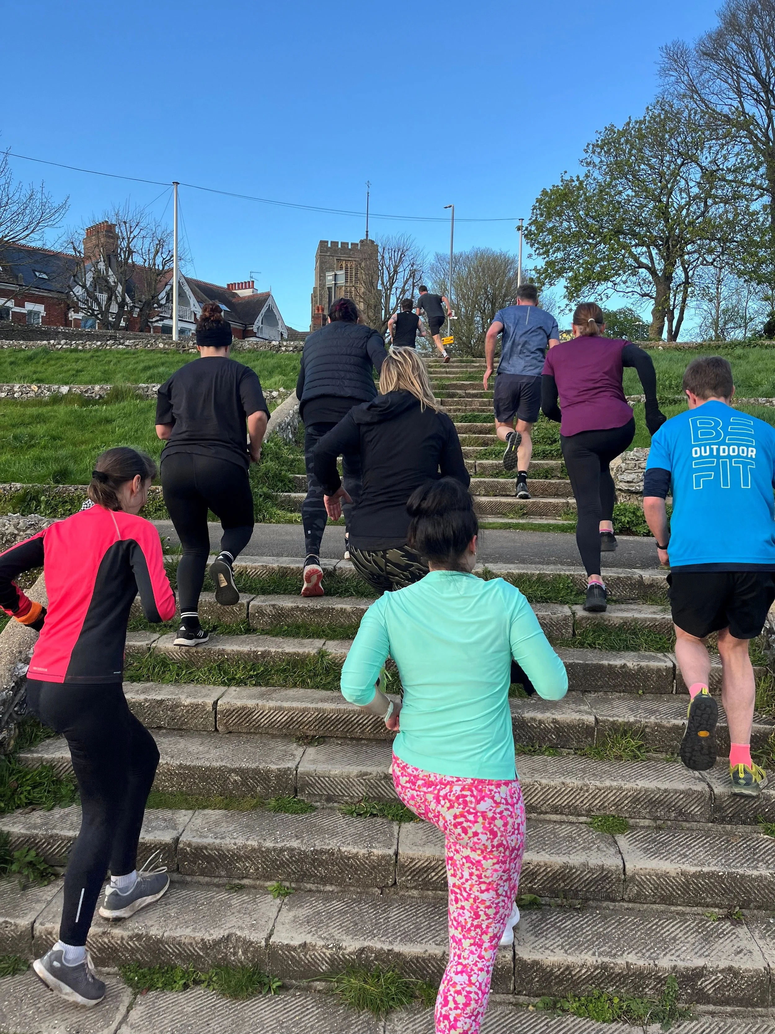 Running up some steps at Preston Park Velodrome.