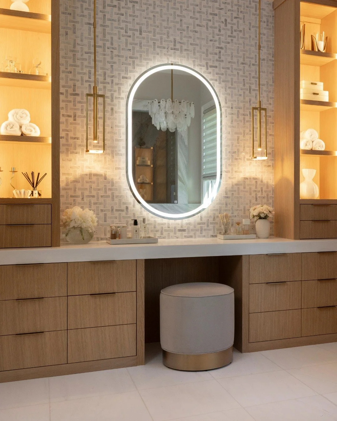 Our idea of an everyday oasis: a beautiful primary bath and a closet that keeps everything in its place.

Custom storage, warm wood, statement lighting, and stone finishes bring it all together in a way that feels luxurious, but still designed for ev