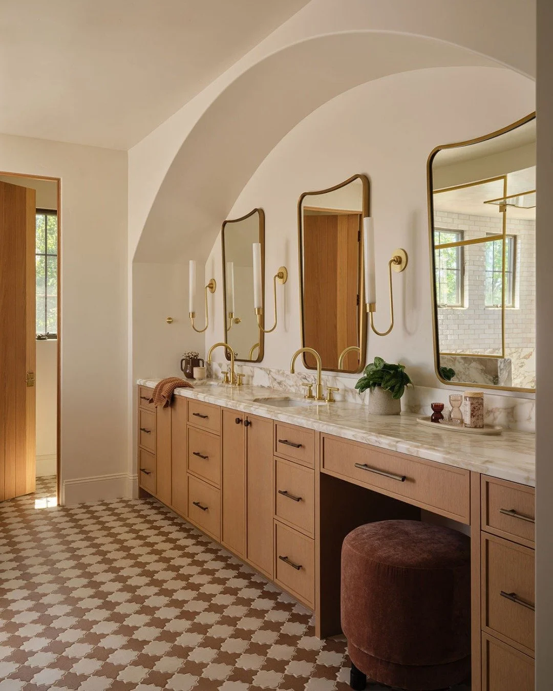 Current mood: our #MediterraneanRevival primary bath. 🤍

A little pattern goes a long way, especially when the rest of the materials have room to breathe. We paired the patterned floor tile with warm wood, natural stone, and brass to give the space 